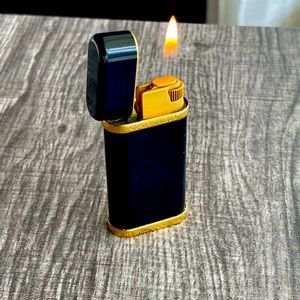 SOLD Cartier vintage lighter- short oval model- gold/black lacquer